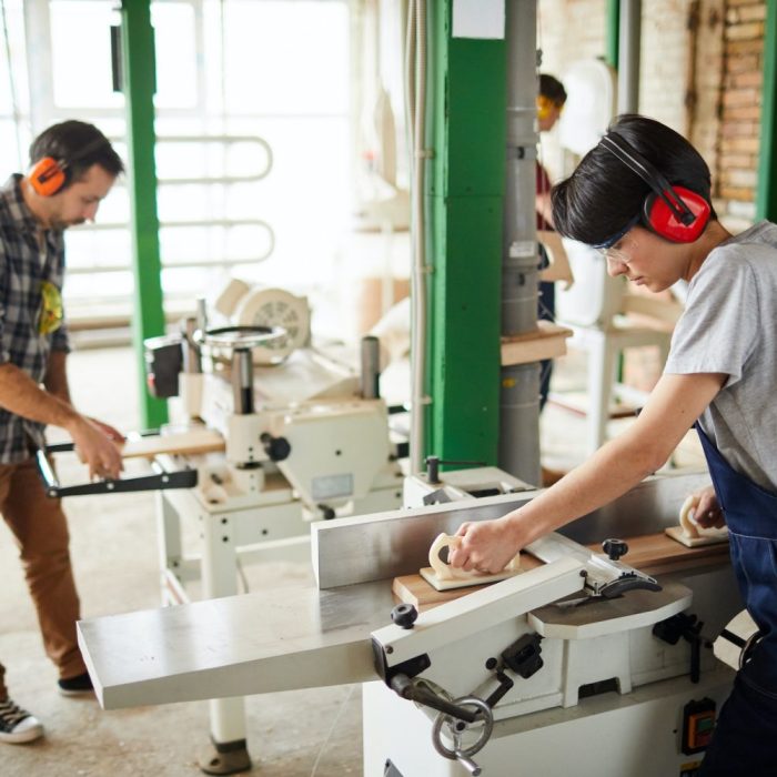 Workers Using Woodworking Machines